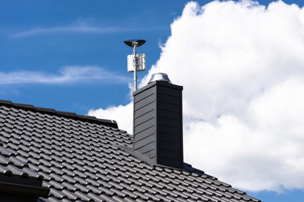Antenna amplifier for home mobile Internet and a TV receiver mounted on the chimney.